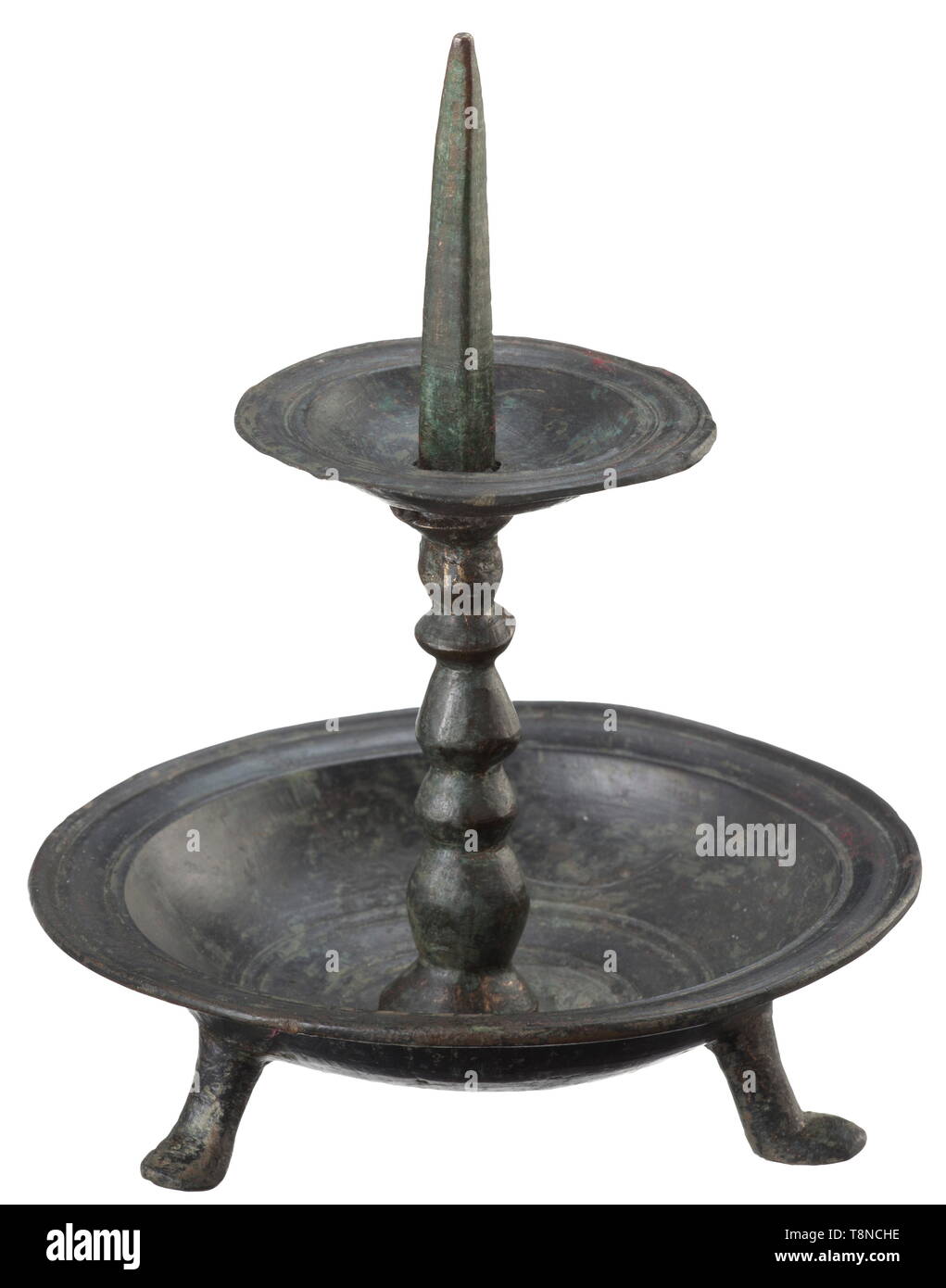 A Romanesque pricket candleholder, Lower Rhine region, 10th/11th century Bronze with fine greenish patina. Candleholder made of several pieces with a bowl-shaped base on three small feet. Baluster shaft with drip pan and pricket of square section. Height 14 cm. historic, historical, handicrafts, handcraft, craft, object, objects, stills, clipping, clippings, cut out, cut-out, cut-outs, middle ages, Additional-Rights-Clearance-Info-Not-Available Stock Photo