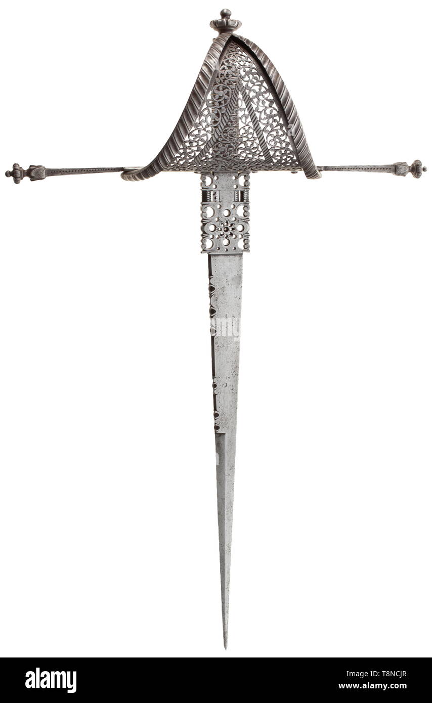 A Spanish left-hand dagger, circa 1680 Single-edged blade with chiselled back and elaborately chiselled and pierced ricasso. Long quillons with florally chiselled and engraved terminals. Riveted hand-guard with distinctive flange and finely pierced scrolling leaves. Grip with wire wrap, pommel decorated en suite to the quillon terminals. Length 53 cm. Elegant, finely crafted dagger. historic, historical, dagger, daggers, thrusting, thrustings, baton, weapon, arms, weapons, arms, fighting device, object, objects, stills, clipping, cut out, cut-out, Additional-Rights-Clearance-Info-Not-Available Stock Photo