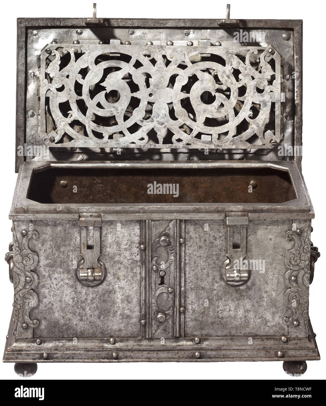 A heavy Southern German iron casket, presumably Nuremberg, circa 1620 Rectangular sheet iron body, reinforced edges with engraved and embossed decoration. Stepped base on four iron ball feet. False lock with curved escutcheon at the front, two hasps (partially replaced) with attached triangular locks (each one marked). The hinged lid with heavily reinforced edges. The cover of the central keyhole with hidden locking and spring-loaded lid. The inside with elaborate locking mechanism with tenfold locking. Replaced hollow shank key. Lavish openwork , Additional-Rights-Clearance-Info-Not-Available Stock Photo