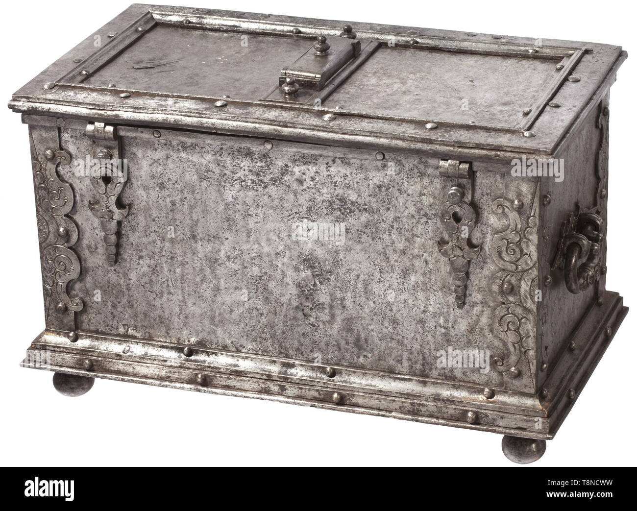 A heavy Southern German iron casket, presumably Nuremberg, circa 1620 Rectangular sheet iron body, reinforced edges with engraved and embossed decoration. Stepped base on four iron ball feet. False lock with curved escutcheon at the front, two hasps (partially replaced) with attached triangular locks (each one marked). The hinged lid with heavily reinforced edges. The cover of the central keyhole with hidden locking and spring-loaded lid. The inside with elaborate locking mechanism with tenfold locking. Replaced hollow shank key. Lavish openwork , Additional-Rights-Clearance-Info-Not-Available Stock Photo