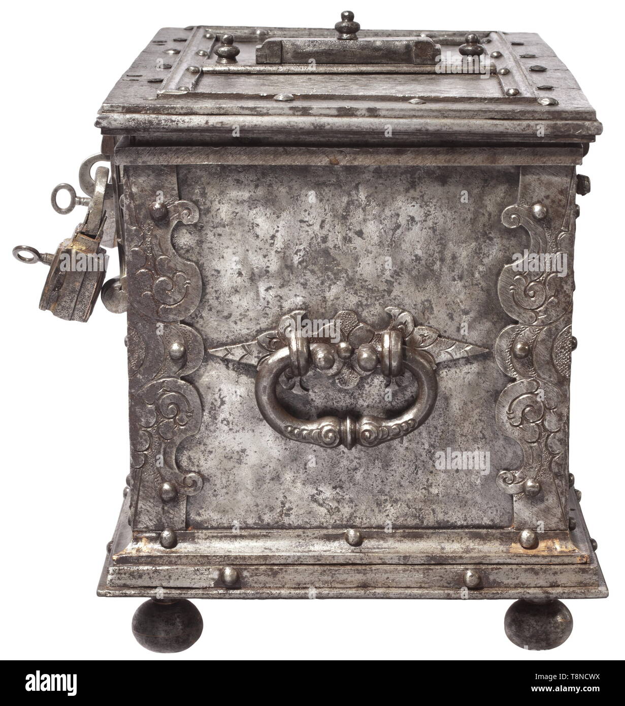 A heavy Southern German iron casket, presumably Nuremberg, circa 1620 Rectangular sheet iron body, reinforced edges with engraved and embossed decoration. Stepped base on four iron ball feet. False lock with curved escutcheon at the front, two hasps (partially replaced) with attached triangular locks (each one marked). The hinged lid with heavily reinforced edges. The cover of the central keyhole with hidden locking and spring-loaded lid. The inside with elaborate locking mechanism with tenfold locking. Replaced hollow shank key. Lavish openwork , Additional-Rights-Clearance-Info-Not-Available Stock Photo