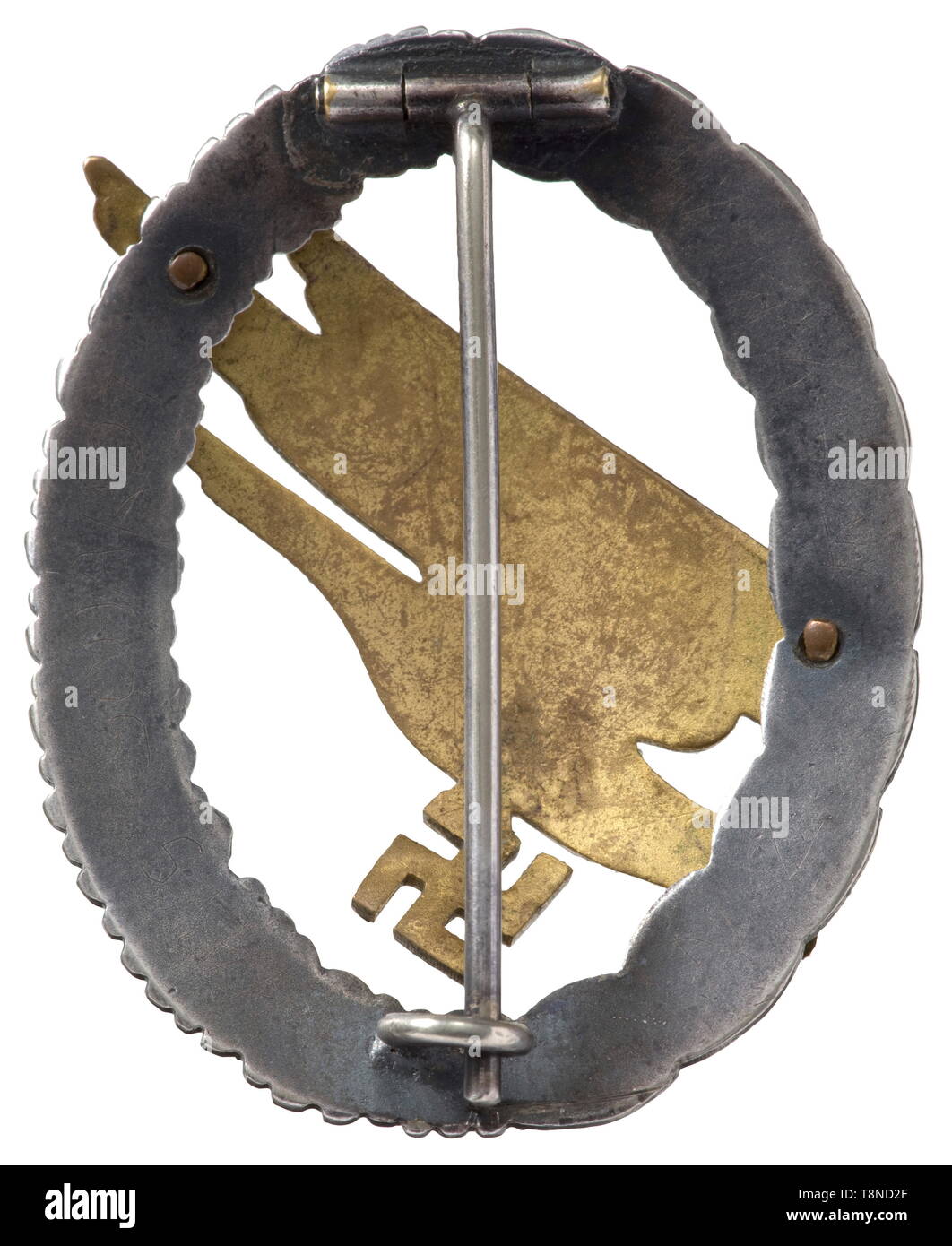 A Paratroper Badge and cuff title - Jäger Rgt. 1 The badge in the thin, non-ferrous metal issue of the Wilhelm Deumer firm in Lüdenscheid (Type A, Durante p. 185). Gilt eagle, burnished wreath, in an outstanding state of preservation. Width 42.8 mm. Weight 25.3 g. Included is a cuff title 'Fallschirm-Jäger Rgt.1' in machine embroidered issue on green cloth. Length 48 cm. The wearer was Hans Schardt, II./Fallschirmj. Rgt. 1. historic, historical, awards, award, German Reich, Third Reich, Nazi era, National Socialism, object, objects, stills, medal, decoration, medals, decora, Editorial-Use-Only Stock Photo