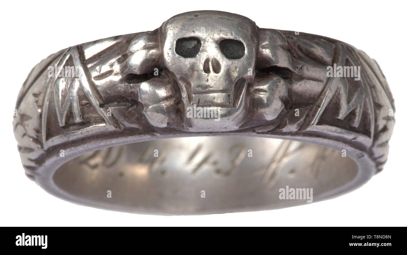 A death's head ring of SS-Sturmbannführer Matz Customised production of the jeweller Gahr, Munich, separately soldered-on death's head, the inner surface with engraved dedication 'S.lb. Matz 20.4.43 H. Himmler'. Weight 10.5 g, inside diameter 19 mm. Sturmbannführer Matz (1897 - 1956) was a major of the Schutzpolizei, deployed in Sevastopol and Trieste. When the ring was bestowed, he was on the higher staff of the SS and police leader in the Crimean sector. historic, historical, 20th century, 1930s, 1940s, Waffen-SS, armed division of the SS, armed service, armed services, N, Editorial-Use-Only Stock Photo
