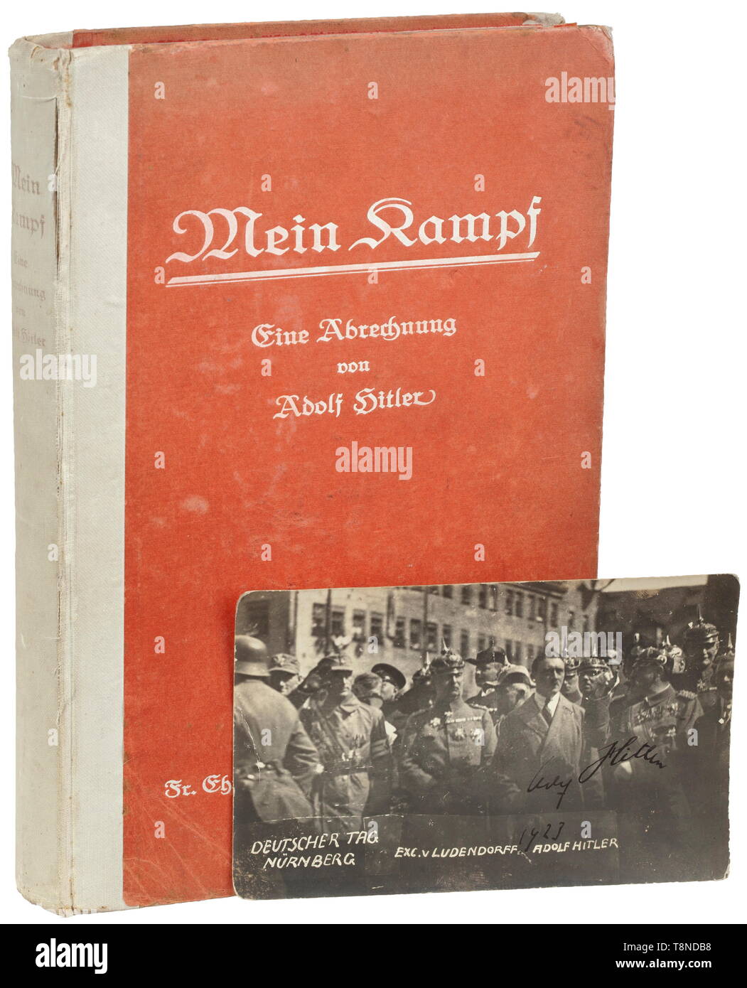Adolf Hitler - a first edition of 'Mein Kampf' (volume 1) with handwritten ink dedication of 1925 to Ernst Wieser On the flyleaf a dedication (tr.) 'Dedicated to Mr. Ernst Wieser in remembrance of the time spent in Landsberg a/L. fortress with best regards - Adolf Hitler - Munich 17/Sept. 1925'. On the title page ink signature 'Ernst Wieser 17.9.1925'. Cover knocked, stained. With photo postcard (tr.) 'German Day Nuremberg - Exc. v Ludendorff - Adolf Hitler' with handwritten ink signature 'Adolf Hitler 1923' , with another signature at back '7.9.23 Ernst Wieser'. Also two g, Editorial-Use-Only Stock Photo