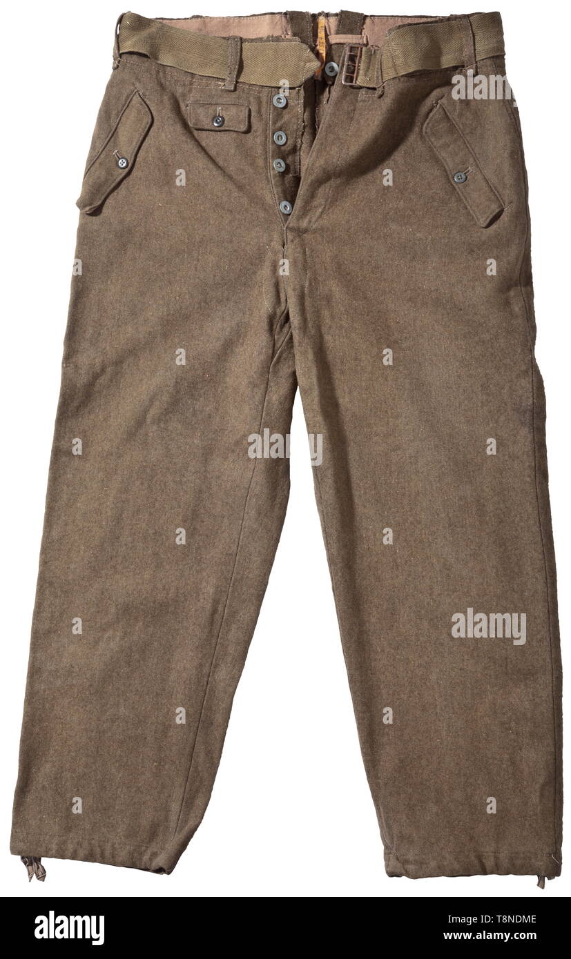 Trousers M 44 for enlisted men - a depot piece The trousers in rough, earth brown woollen cloth. Lateral button-up pockets, two hip- and one watch pocket. With straps and thongs at the waist and leg ends. At the waistband depot stamp and RB number, reverse stitched leather band with size stamping '21/4 +9513T 23/4'. Various buttons, large size. Minimally worn, very rare. historic, historical, army, armies, armed forces, military, militaria, 20th century, Editorial-Use-Only Stock Photo