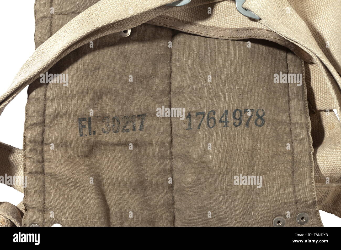 A chest-mounted parachute, type 550 Packed with many utility belts, the type label has been removed. Includes a (related?) parachute test certificate. Parachute harness with straps of robust linen, stamped with supply numbers 'Fl. 30217' and '1764978', rip cord with grip, quick-release fastener with inscription 'SA Schloss', supply number 'FL. 30232, Gerät-Nr. 10-10 C-1', factory number '4143223'. Comes with a green linen packing sack with patent push buttons 'DRP - Zieh hier', two carrying handles. Not checked for functionality or completeness, some parts with stamp or lab, Editorial-Use-Only Stock Photo