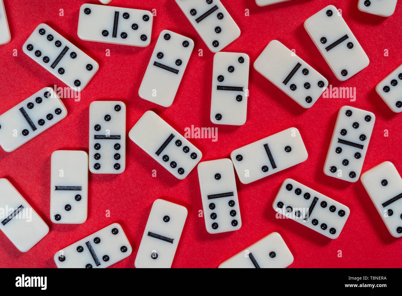The Domino Game Pieces On A Red Colored Surface Stock Photo Alamy