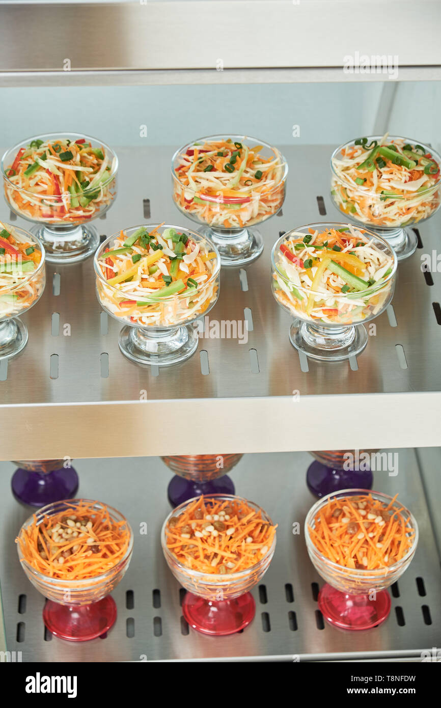 Showcase refrigerator for catering with cooked food. Sweet desserts, hot dishes and salads Stock