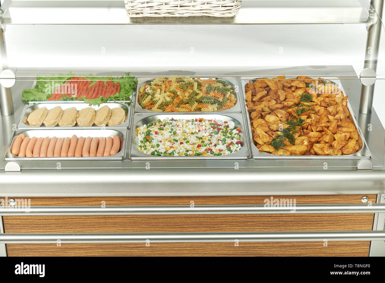 Showcase refrigerator for catering with cooked food. Sweet desserts, hot dishes and salads Stock