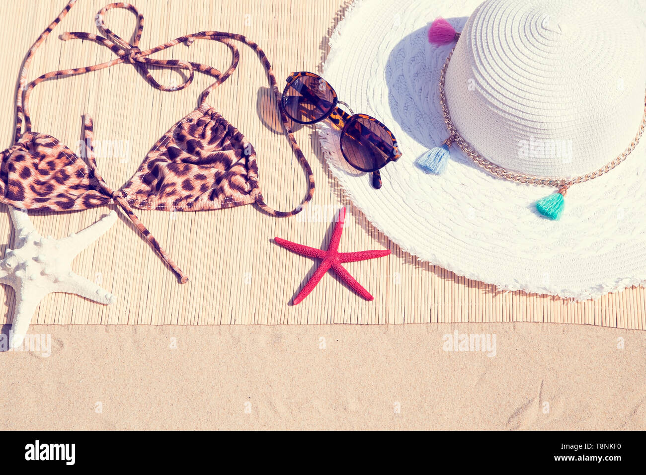 Woman's beach accessories on sand Stock Photo