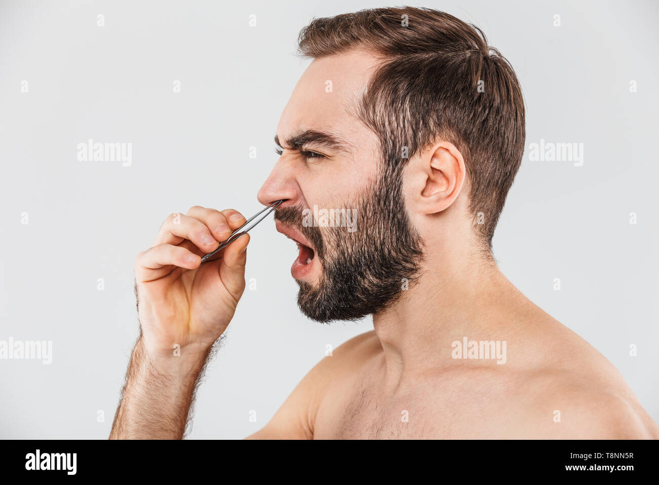 Close Up Portrait Of A Suffering Bearded Man Standing Isolated