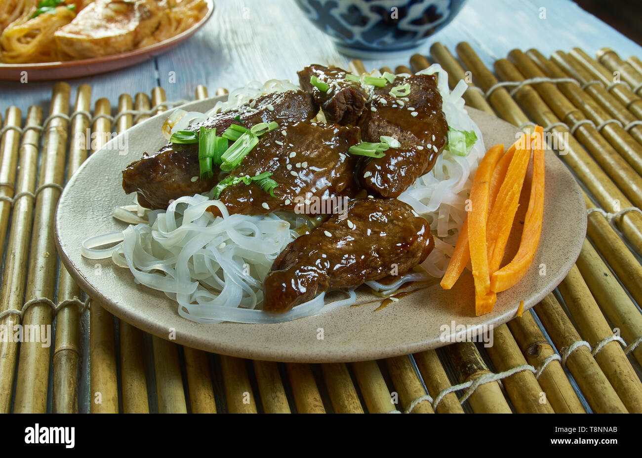 Honey Sriracha Mongolian Beef with Rice Noodles Stock Photo Alamy