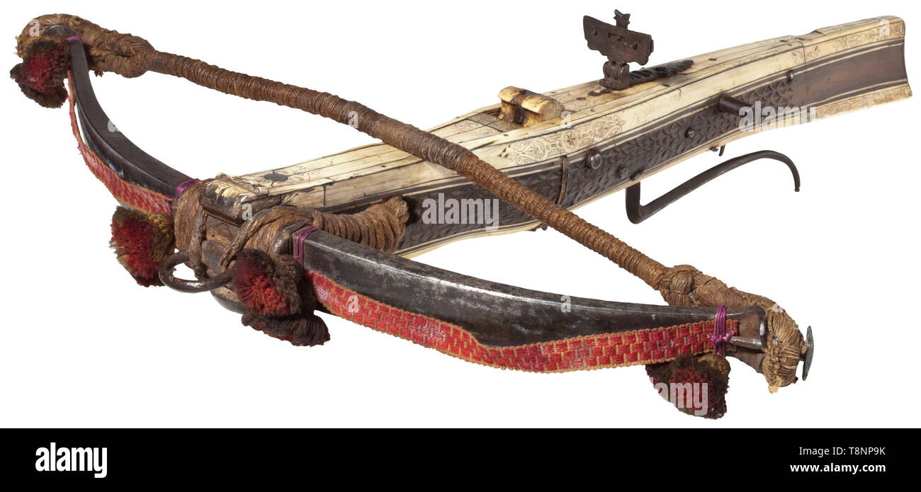 https://c8.alamy.com/comp/T8NP9K/a-german-hunting-crossbow-17th-century-heavy-iron-prod-with-a-woven-lanyard-and-woollen-tassels-later-hemp-bowstring-retained-by-cords-slightly-bulgy-tiller-with-carvings-at-the-sides-the-upper-and-lower-surfaces-with-bone-inlays-and-finely-engraved-with-decorative-scrollwork-and-tendrils-on-the-top-and-depictions-of-a-hunter-and-the-birth-of-venus-at-the-lower-side-original-finely-chiselled-iron-aperture-sight-bolt-clip-is-missing-multi-axle-lock-with-iron-trigger-guard-length-66-cm-historic-historical-crossbow-crossbows-distance-additional-rights-clearance-info-not-available-T8NP9K.jpg