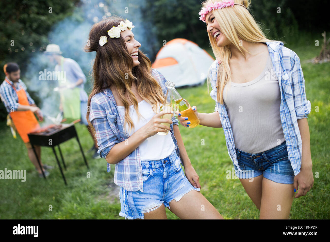 Group of happy friends having barbecue party in forest Stock Photo - Alamy