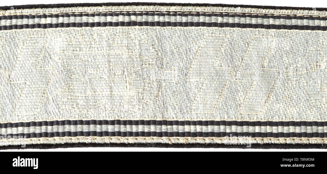 A waist belt for the black dress uniform for leaders Aluminium brocade with woven-in SS runes between oak leaf branches and doubled black edge trim, black velvet liner (light damage). Complete with both slides, aluminium buckle and pressure hook. The buckle (diametre 50 mm) with stamped motto, national symbol and reverse stampings 'RZM', 'SS', '36/39' and 'OLC' (Overhoff & Cie, Lüdenscheid). Signs of use and age. Length 102 cm. Rare. historic, historical, 20th century, 1930s, 1940s, Waffen-SS, armed division of the SS, armed service, armed services, NS, National Socialism, , Editorial-Use-Only Stock Photo