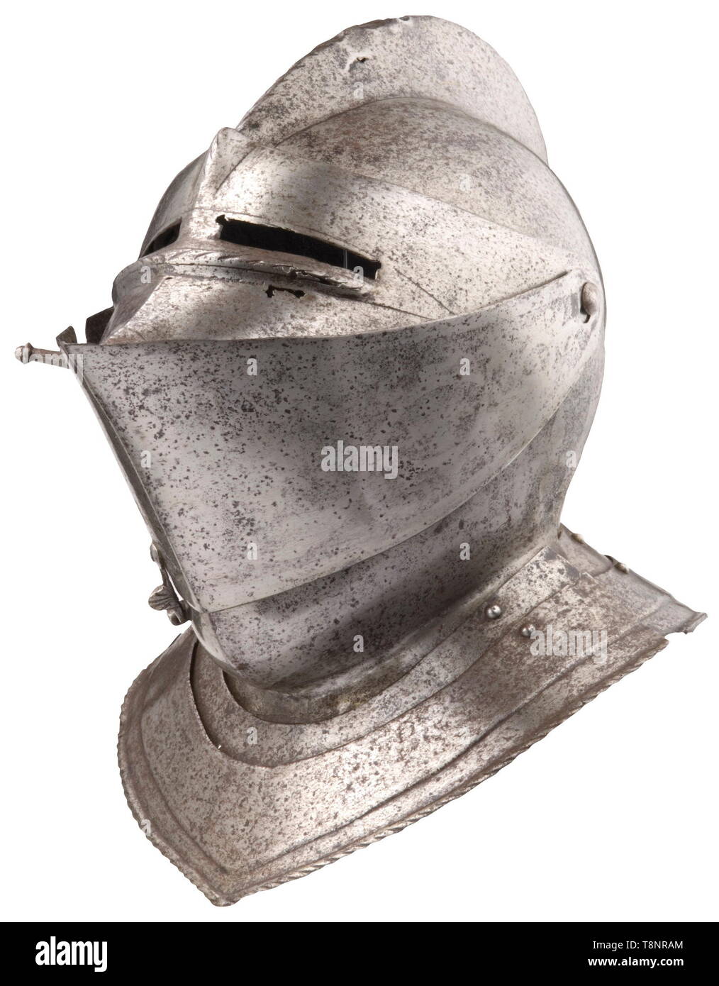 An English close helmet, circa 1570 Old assembled helmet with the skull forged in one piece, and a high, corded crest (ca. 1 cm large defect). Two-piece visor, opening upward. Separate eye slits with corded flanges on the underside. Small defects on the left side. Repairs to the point of the visor. The bevor has the two original hook latches, with grips chiselled in the shape of shells. Two riveted neck lames repaired in several places. The upper one restored at the nape. Height 29 cm. Provenance: Hermann Historica, auction 52, 4 May 2007, lot 36, Additional-Rights-Clearance-Info-Not-Available Stock Photo