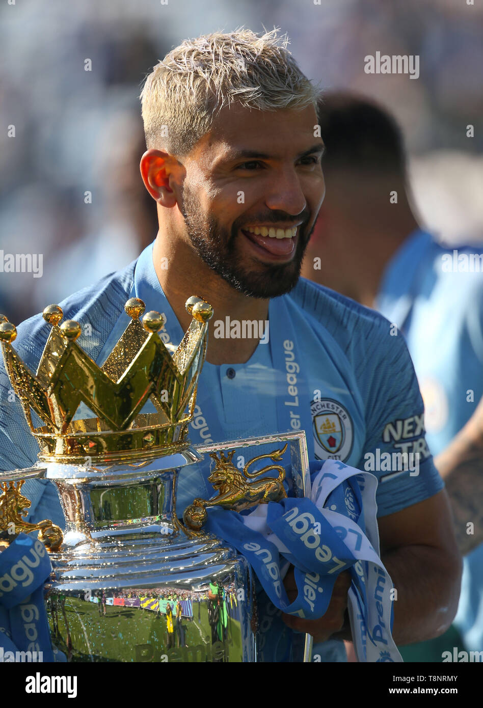 Manchester Citys Sergio Aguero with the Premier League Trophy during the English Premier League soccer match between Brighton Hove Albion and Manchester City at the Amex Stadium in Brighton