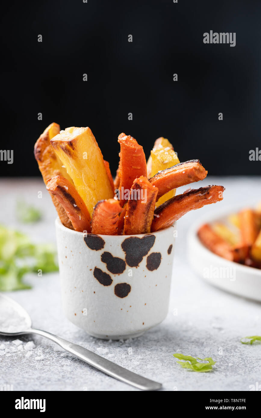 Healthy vegetable carrot and potato french fries. Roasted vegetables Stock Photo