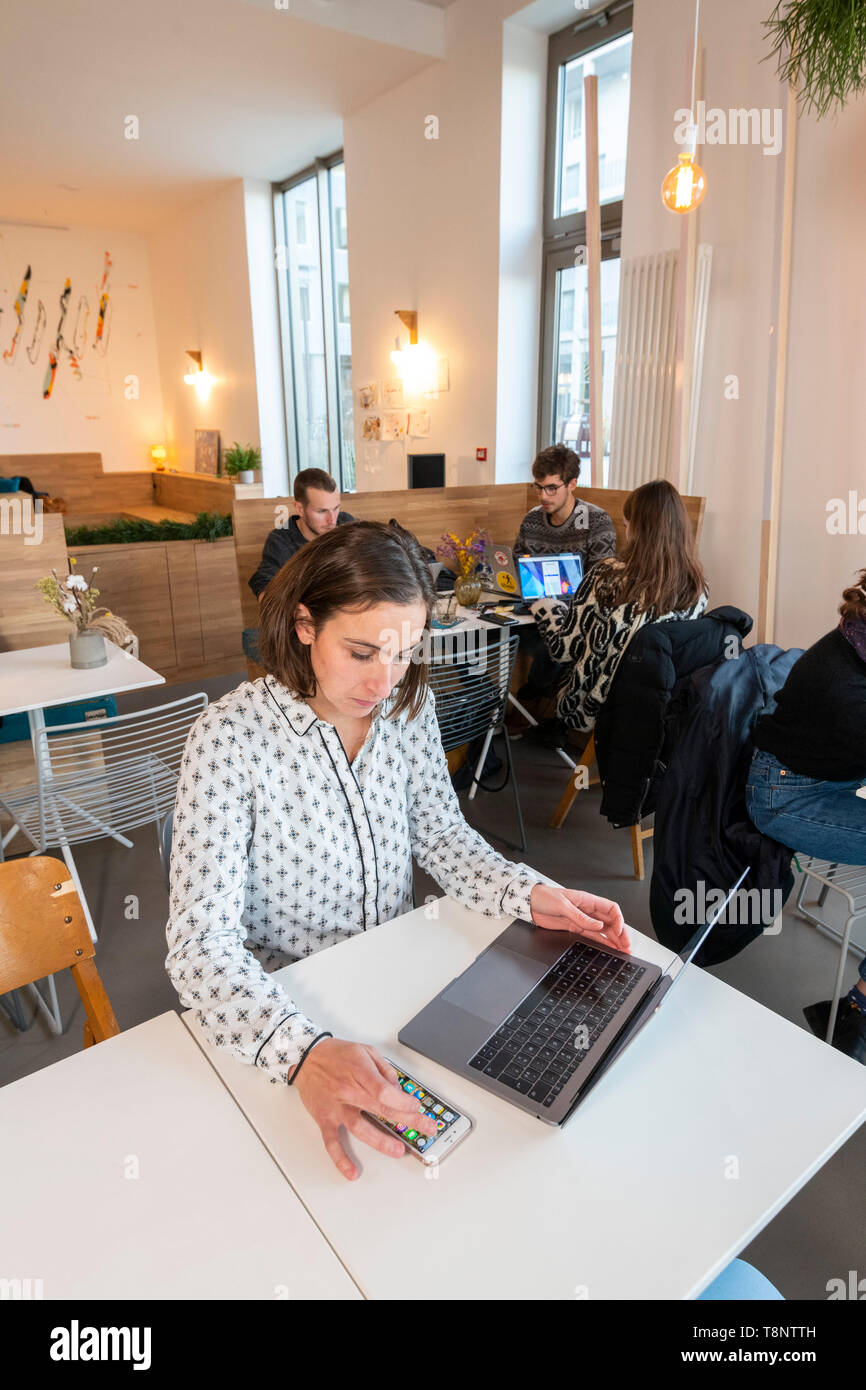 Offices, coworking spaces on the river island of Nantes (north-western France), Zero Newton building Offices for coworkers, coworking spaces: young wo Stock Photo