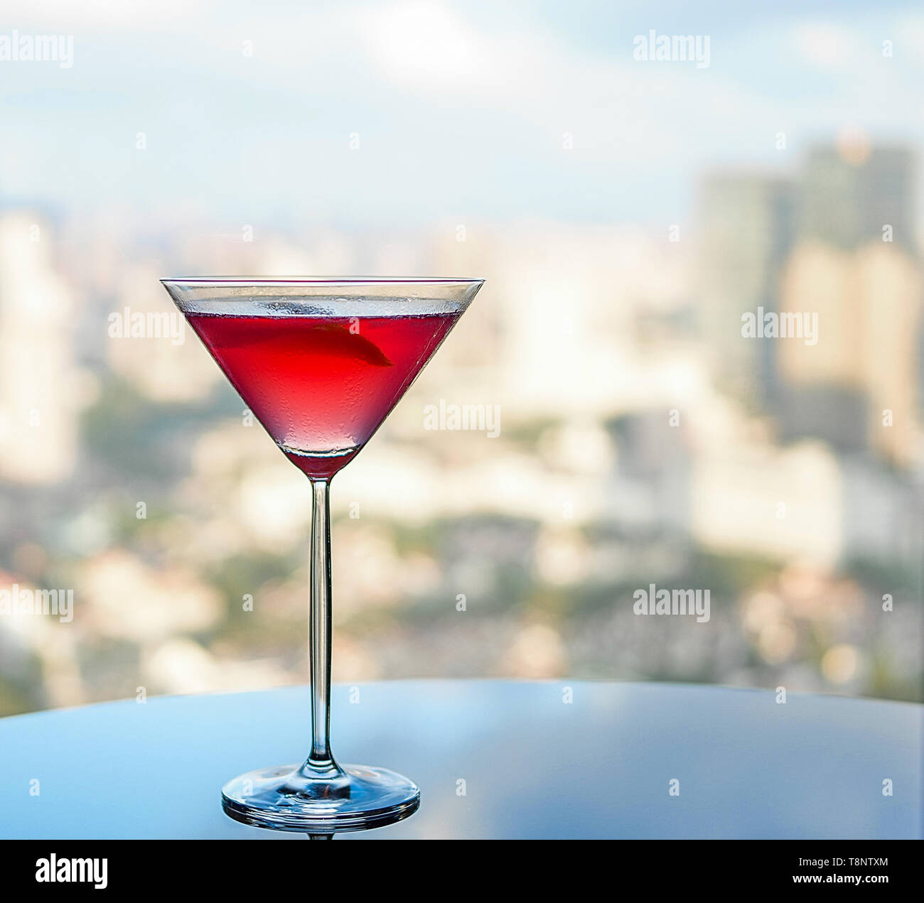 Red cocktail martini glass near window Stock Photo Alamy