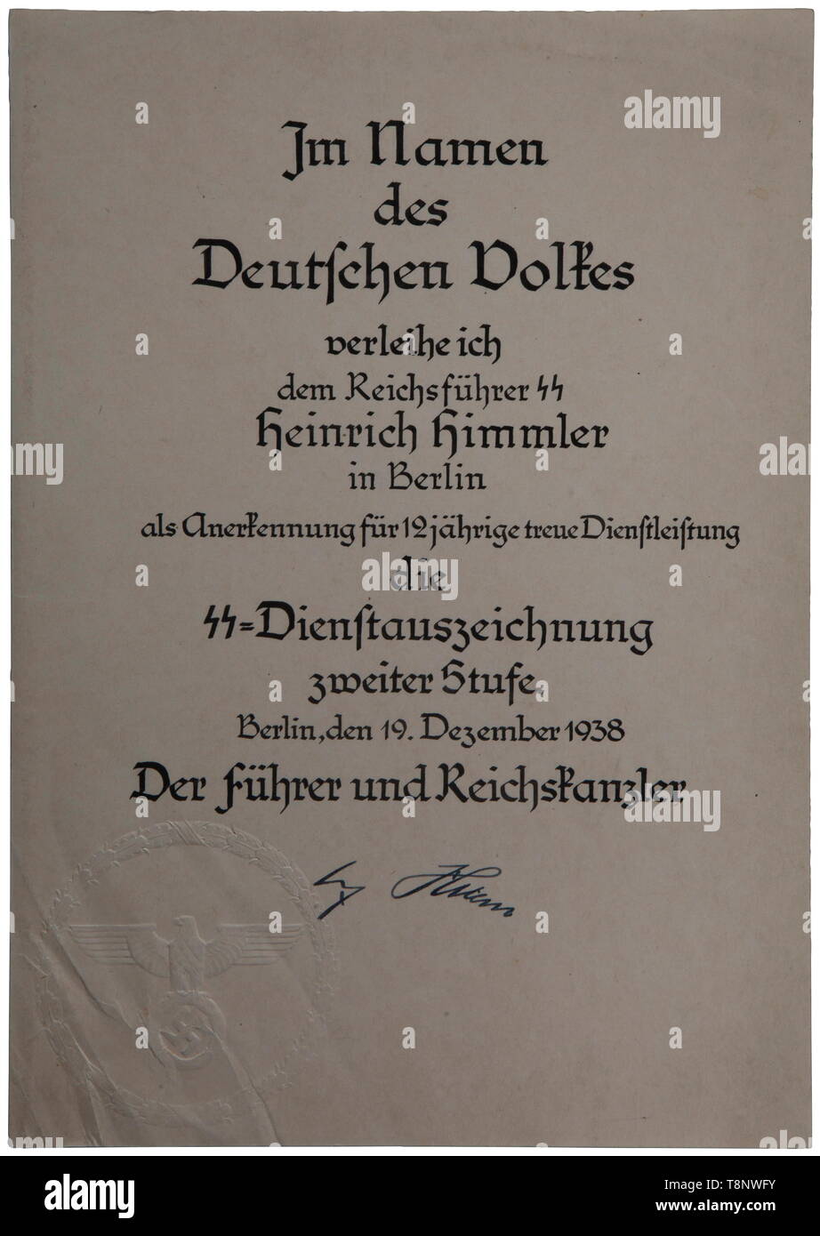 Heinrich Himmler's award document for an SS service medal, grade II Issued in Berlin to Reichsführer SS Heinrich Himmler, by Adolf Hitler, 19 December 1938, for twelve years of service in the SS. Size 30 x 22 cm. The text is completed in fine calligraphy. Bottom left-hand corner features a raised seal comprising an eagle and swastika within a wreath, on the right a signature of Adolf Hitler. Very rare. USA-lot, see page 5. historic, historical, 20th century, 1930s, 1940s, Waffen-SS, armed division of the SS, armed service, armed services, NS, National Socialism, Nazism, Thi, Editorial-Use-Only Stock Photo