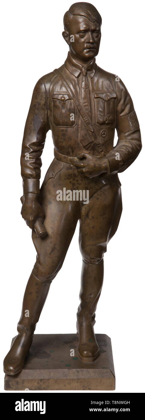 A bronze statuette of Adolf Hitler - Theodor Kärner Standing figure, upright in contrapposto, with Iron Cross 1st Class and Wound Badge as well as the national eagle on the tie, holding a roll in his right hand. Bronze, slightly rubbed, signed on the plinth 'T. KÄRNER MÜNCHEN'. Total height 40 cm. Expressive figurine by professor Theodor Kärner (1884 - 1966), who became famous primarily for his drafts as the artistic director of the Allach Porcelain Factory. USA-lot, see page 5. historic, historical, 20th century, 1930s, 1940s, fine arts, art, NS, National Socialism, Nazism, Editorial-Use-Only Stock Photo
