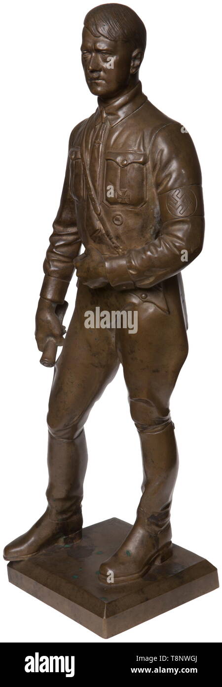 A bronze statuette of Adolf Hitler - Theodor Kärner Standing figure, upright in contrapposto, with Iron Cross 1st Class and Wound Badge as well as the national eagle on the tie, holding a roll in his right hand. Bronze, slightly rubbed, signed on the plinth 'T. KÄRNER MÜNCHEN'. Total height 40 cm. Expressive figurine by professor Theodor Kärner (1884 - 1966), who became famous primarily for his drafts as the artistic director of the Allach Porcelain Factory. USA-lot, see page 5. historic, historical, 20th century, 1930s, 1940s, fine arts, art, NS, National Socialism, Nazism, Editorial-Use-Only Stock Photo