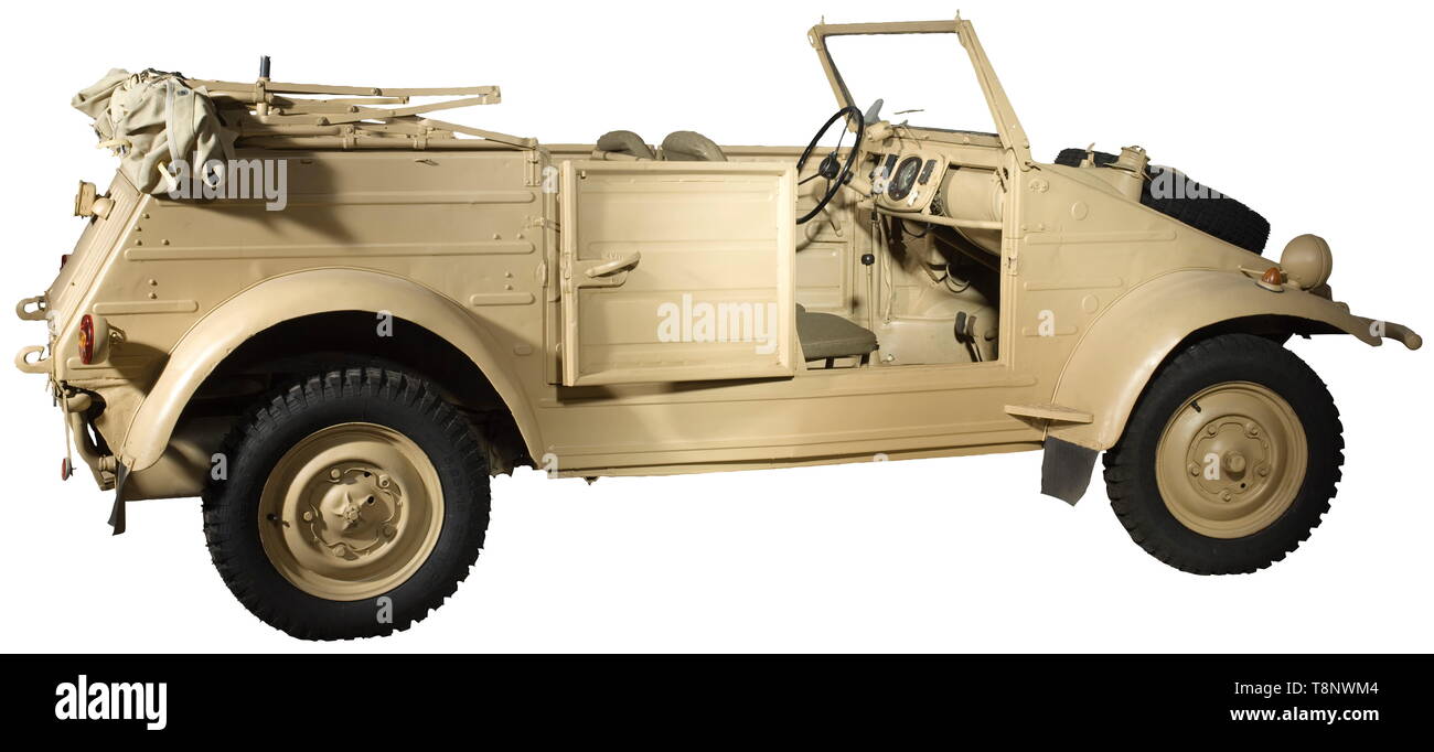 A VW-Kübelwagen type 82 Production year 1942. Roadworthy. Chassis no. 2-007969, structure no. 7911. Unrestored condition, modifications to ensure further drivability. Chassis with dotted chassis number. Gearbox, front axle, rear axle, steering gear with KDF mark (early type with aluminium lid) and all four shock absorbers original. Engine (30 HP) and braking system replaced (hydraulic brake refitted) as well as floor pans. 16-inch rims riveted, tyres replaced. Original body: All nameplates original as well as the originally welded in rear panel (, Additional-Rights-Clearance-Info-Not-Available Stock Photo