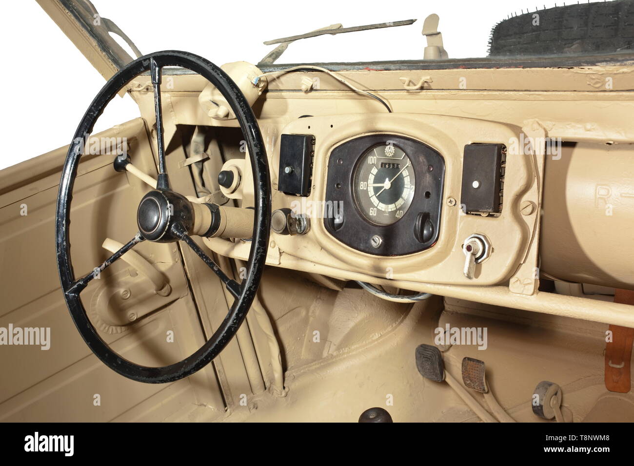 A VW-Kübelwagen type 82 Production year 1942. Roadworthy. Chassis no. 2-007969, structure no. 7911. Unrestored condition, modifications to ensure further drivability. Chassis with dotted chassis number. Gearbox, front axle, rear axle, steering gear with KDF mark (early type with aluminium lid) and all four shock absorbers original. Engine (30 HP) and braking system replaced (hydraulic brake refitted) as well as floor pans. 16-inch rims riveted, tyres replaced. Original body: All nameplates original as well as the originally welded in rear panel (, Additional-Rights-Clearance-Info-Not-Available Stock Photo