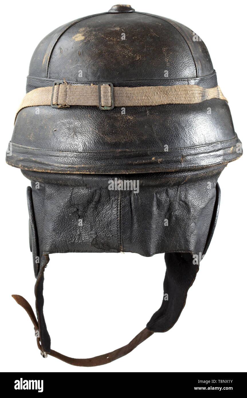 A French pilot's crash helmet type Roold Brown leather cover, offset flange, reinforced ear covers, nape leather and kidskin ear flaps with a black felt liner, leather eyeshade. Lining made from surrogate leather. Including flyer's goggles with anti-mist lenses, metal frame, plush liner. historic, historical, troop, troops, armed forces, military, militaria, army, wing, group, air force, air forces, 20th century, Editorial-Use-Only Stock Photo