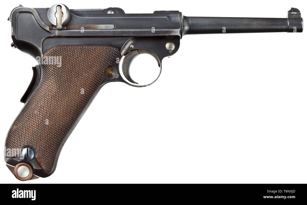 A Parabellum military regulation pistol Mod. 00 (1900), with case Cal. 7.65 mm Parabellum, no. 639. Matching numbers except for trigger plate marked "59". Non-privatised. Mirror-like bore, barrel length 120 mm, replacements according to arsenal regulations. Blued extractor, replaced. Grip safety. On receiver head Swiss cross in an aureola, front toggle link marked "DWM". Original finish somewhat thin on grip. Operational parts strawed. Walnut grip panels. Correct, nickel-plated sheet metal magazine with wooden base and small metal plates on both , Additional-Rights-Clearance-Info-Not-Available Stock Photo