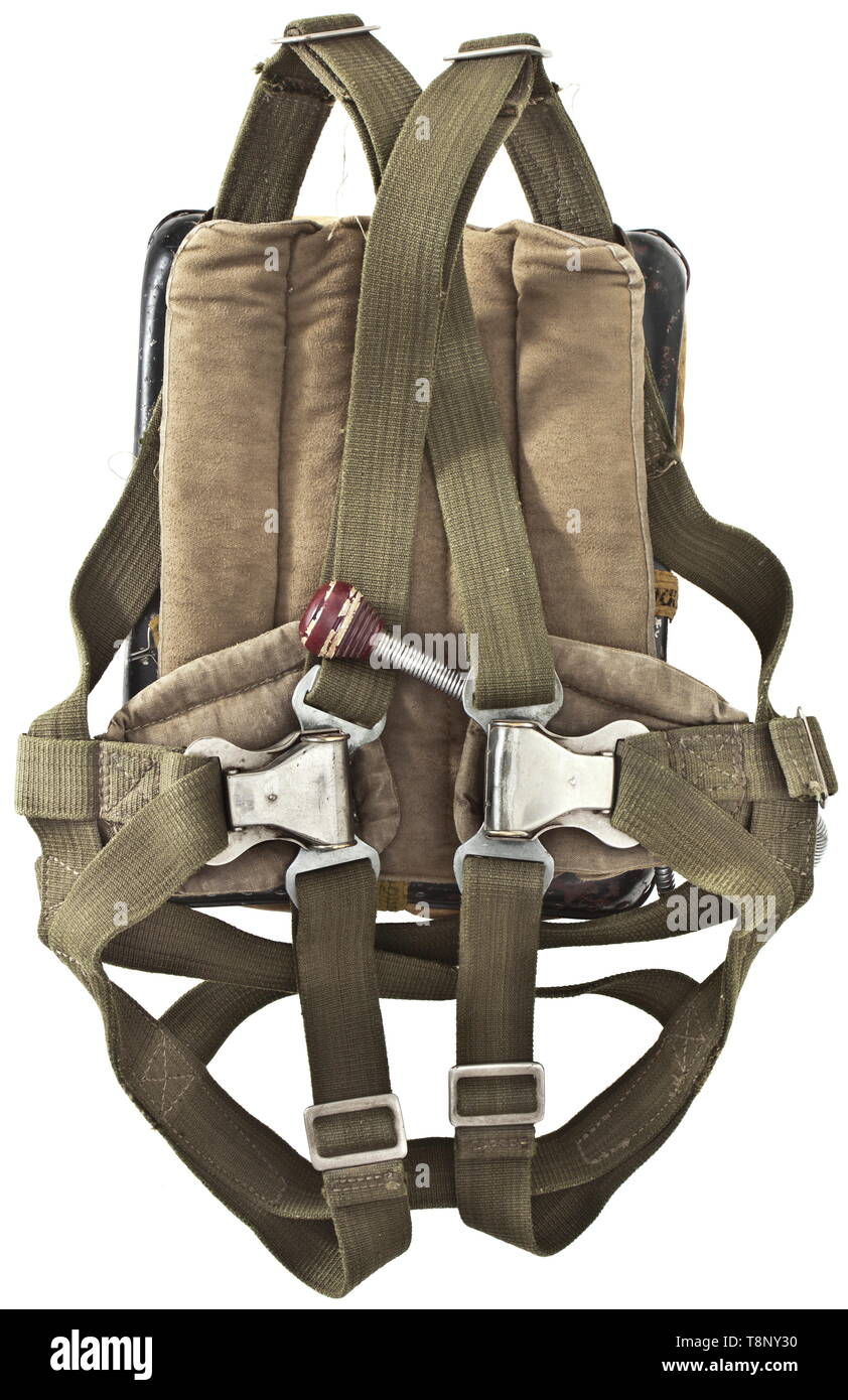 A back parachute model RH-28, with bag Packed, with many extension belts and other elements. Type specification plate with request sign '402008' and inscription 'Rückenfallschirm', ripcord with grip, also 'Gerät-Nr. 10-409-A1', serial number '1078442'. Including green linen storage bag with patent press buttons 'DRP - Zieh hier', two handles. Not checked for functionality and completeness, parts partially stamped and labelled. Cf. auction 64, lot no. 7462. Parachutes of this type were used for the Me-262 jet fighter. Rare. historic, historical, Air Force, branch of service,, Editorial-Use-Only Stock Photo
