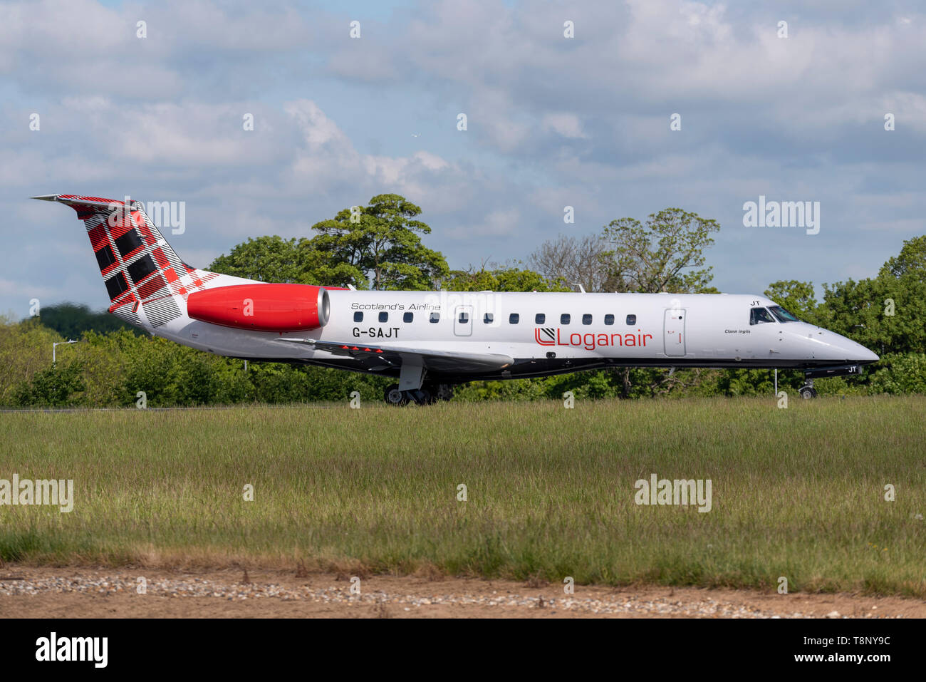 Loganair Embraer ERJ135 airliner at London Southend Airport, Essex, UK. Tartan tail. Lined up for take off Stock Photo