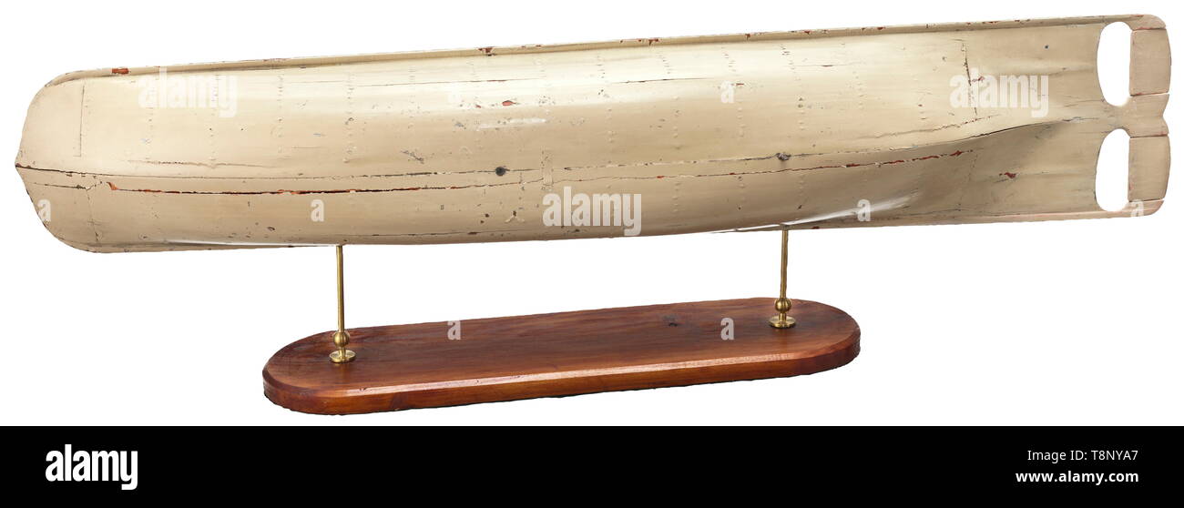 A model of an early torpedo, mid-19th century Very good model boat in wood, painted in white, the rear with two movable side rudders, four pierced lateral iron cable guides (the front two broken off), mounted on a base with brass holder. Length 152 cm, width 32 cm, height 22 cm. Provenance: Caproni collection. Attached inventory label 'Modello di Nave a Specchio'. Probably an early torpedo model of the Austro-Hungarian navy officer and inventor Giovanni Biagio Luppis von Rammer. Giovanni Biagio Luppis von Rammer (1813 - 1875), Croatian inventor, , Additional-Rights-Clearance-Info-Not-Available Stock Photo