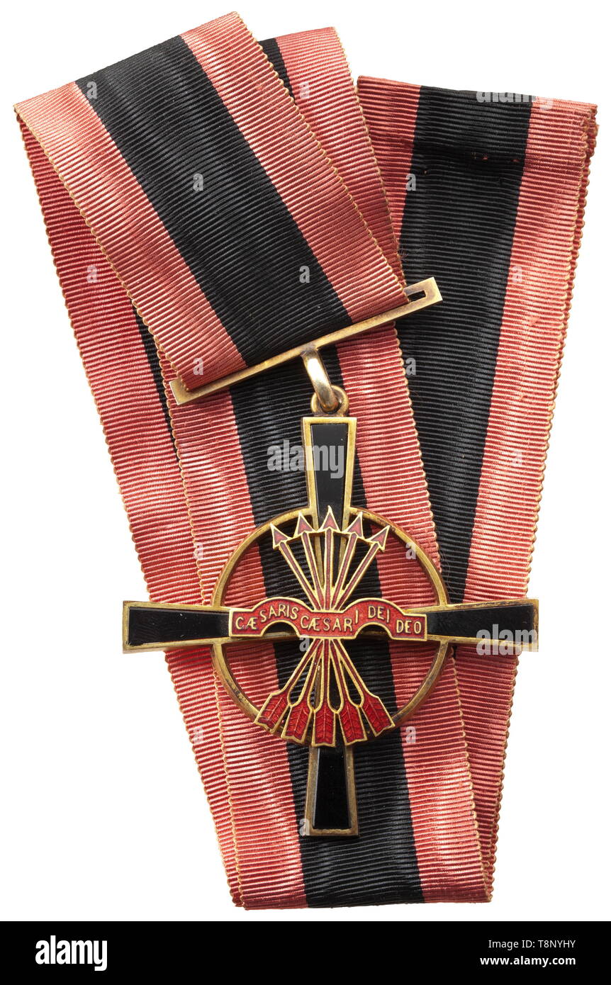 Imperial Order of the Yoke and Arrows (Orden Imperial del Yugo y las Flechas) Commander's Cross (Encomienda Sencilla) of 1943 with statutes of this highest Spanish merit order under General Franco. The black cross of the order with inset onyx stones, the mounting and ribbon clasp of gilt silver and punched with '5Z' and a five-rayed star. The symbol of the Falange Espanola is of translucent red enamel, and the yoke bears the motto of the order 'CAESARIS CAESARI DEI DEO' (tr. Render unto the emperor what is the emperor's and unto God what is God's, Additional-Rights-Clearance-Info-Not-Available Stock Photo