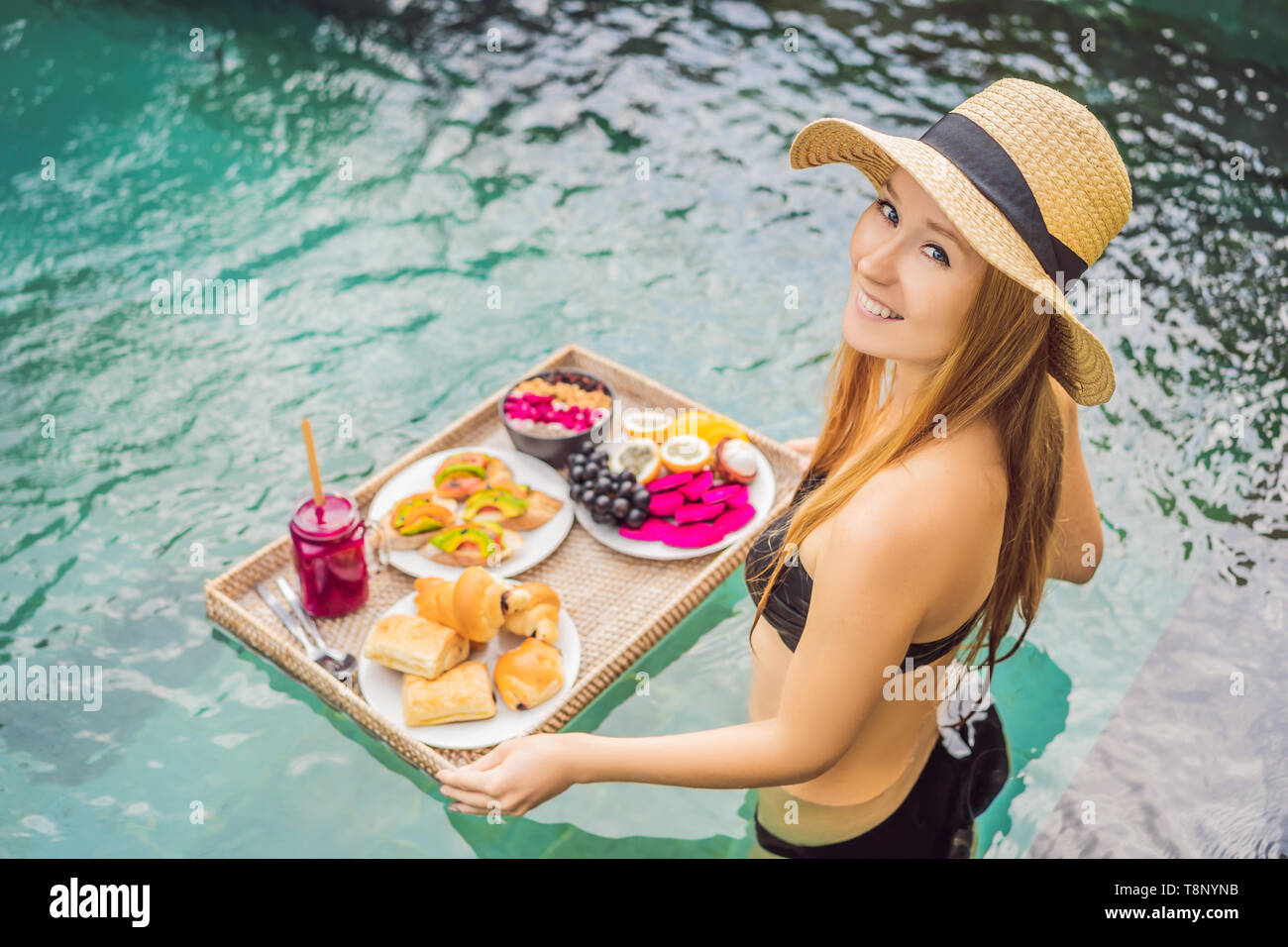 Breakfast tray in swimming pool, floating breakfast in luxury hotel