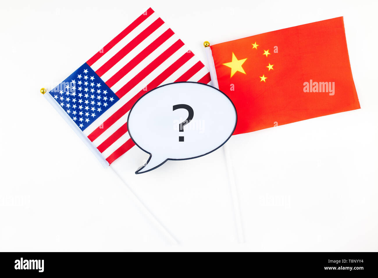 Creative top view flat lay of China and USA flag bubble lightbox with question mark and copy space white background in minimal style. Concept of trade Stock Photo