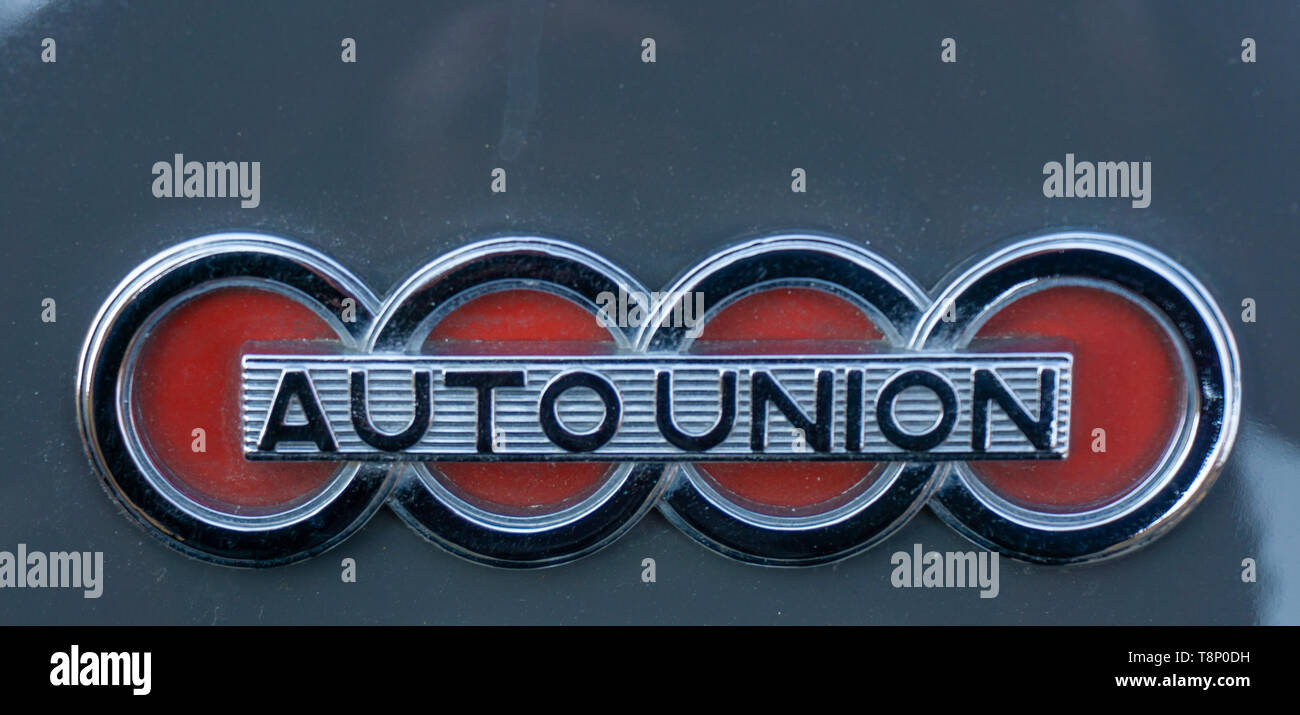 Braunschweig, Germany, April 7., 2019: Metal plate of the no longer existing car brand Auto-Union, chrome-plated and with black and red paint. Predece Stock Photo