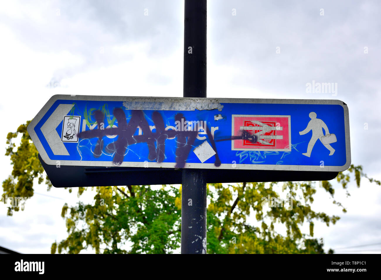 Modern British rail sign vandalized with tagging and graffiti Stock Photo