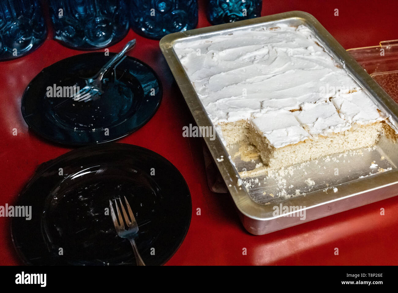 serving up a traditional vanilla white cake after  dinner with the family Stock Photo