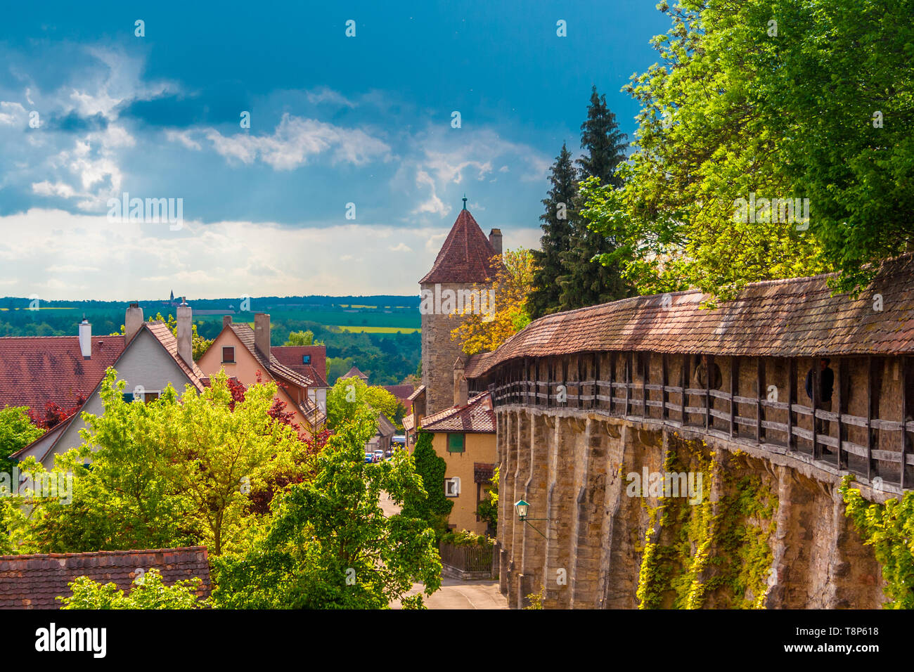 Great panoramic view of the medieval town fortification of Rothenburg ob der Tauber. View of the old city wall and the hangman's tower (Henkersturm)... Stock Photo