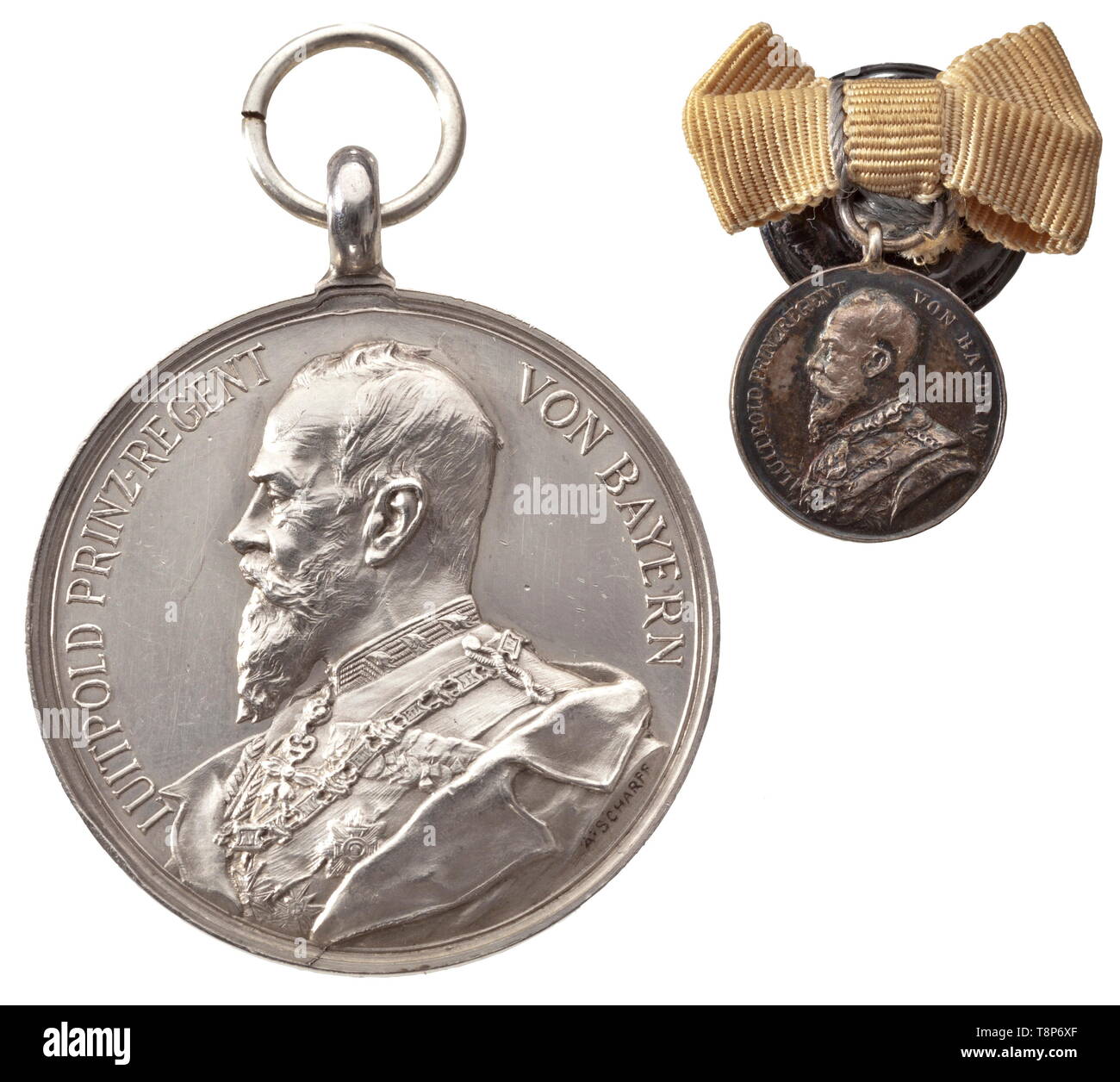 Rittmeister Friedrich von Sigriz - a lifesaving medal with document and miniature The medal of the type instituted in 1889 with the likeness of Prince Regent Luitpold from a punch cutter models by Professor 'A. Scharff' in Vienna. The medal, which was also struck in this form and bestowed after the monarchy from 1920 to 1931, is in an outstanding state of preservation and except for an edge knock and a few scratches is in mint-fresh condition. Diameter 39.7 mm. Weight 30.9 g. Included is the 16 mm miniature on a buttonhole ribbon bow as well as t, Additional-Rights-Clearance-Info-Not-Available Stock Photo