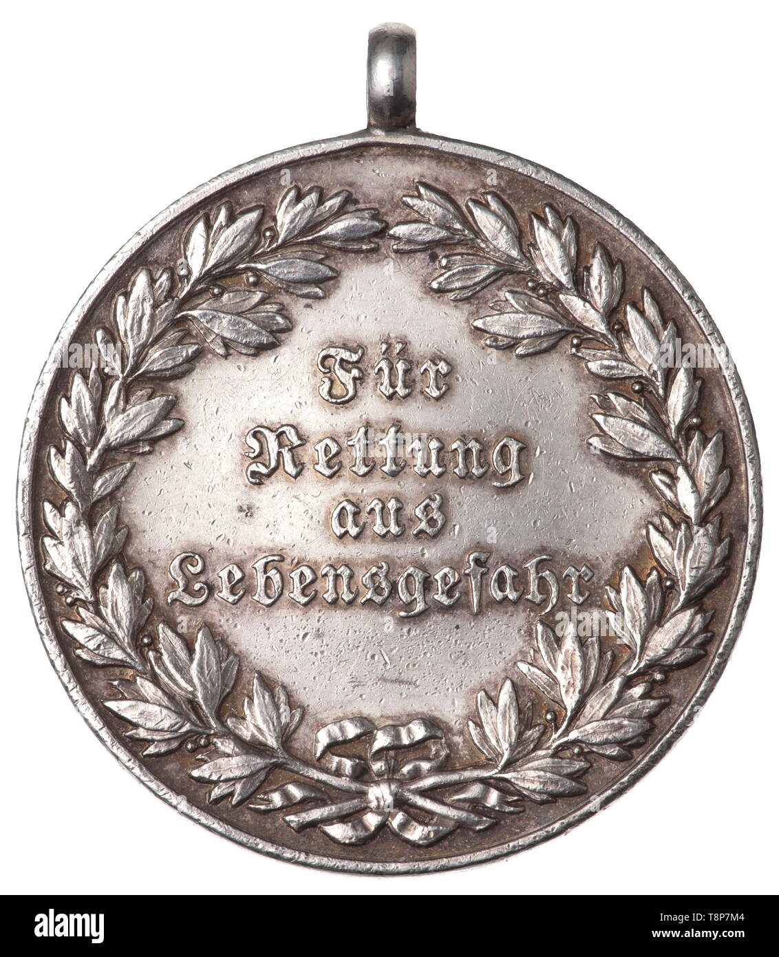 A lifesaving medal - model 1931 Silver medal with objective inscription (tr.) 'For Rescue from Mortal Danger' in German lettering on the obverse and the old Bavarian state coat of arms of 1923 on the reverse. Edge bumps, bored, diameter 41.5 mm. Weight 30.1 g. After the end of the monarchy in Bavaria, from 1920 the lifesaving medal instituted in 1889 with the likeness of Prince Regent Luitpold continued to be awarded. On 14 December 1931 a new republican model was introduced and was bestowed until 8 April 1934, when from that point in time the Re, Additional-Rights-Clearance-Info-Not-Available Stock Photo
