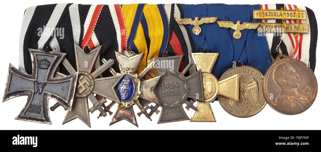 A medals bar of a naval officer - service in German New Guinea and Venezuela Seven piece bar with Prussia: Iron Cross 2nd Class of 1914, German Empire: War Merit Cross 2nd Class with Swords 1939, Schwarzburg-Sondershausen: Honour Cross 3rd Class with Swords with the princely monogram of Günther Friedrich Carl mounted on the obverse (small enamel chip), German Empire: Front Fighter Award, 1934, Wehrmacht Long Service Awards for 25- and 12 years with eagle appliqués, Colonial Commemorative Medal with combat bars 'VENEZUELA 1902/03' and 'DEUTSCH-NEUGUINEA 1913/14'. Combat bars, Editorial-Use-Only Stock Photo