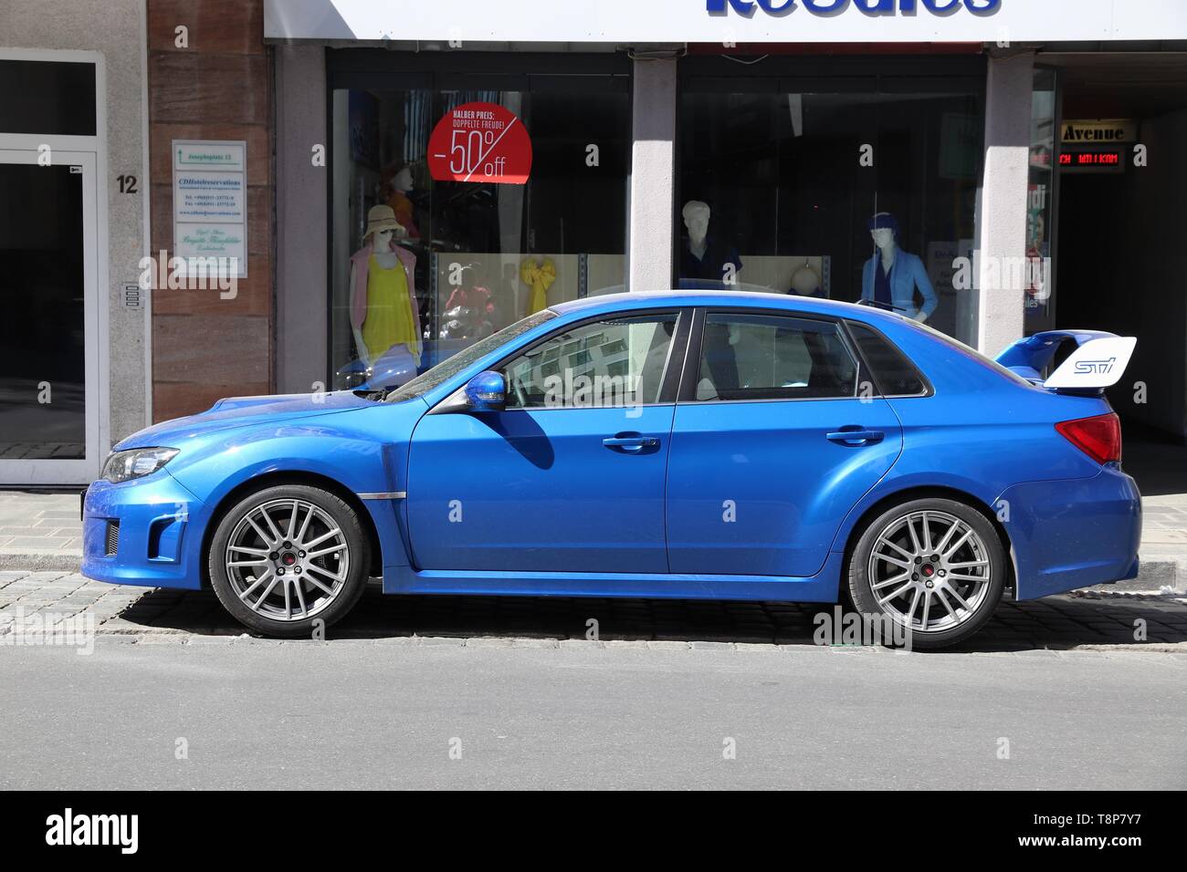 NUREMBERG, GERMANY - MAY 6, 2018: Blue Subaru Impreza WRX STI sports sedan car parked in Germany. There were 45.8 million cars registered in Germany ( Stock Photo