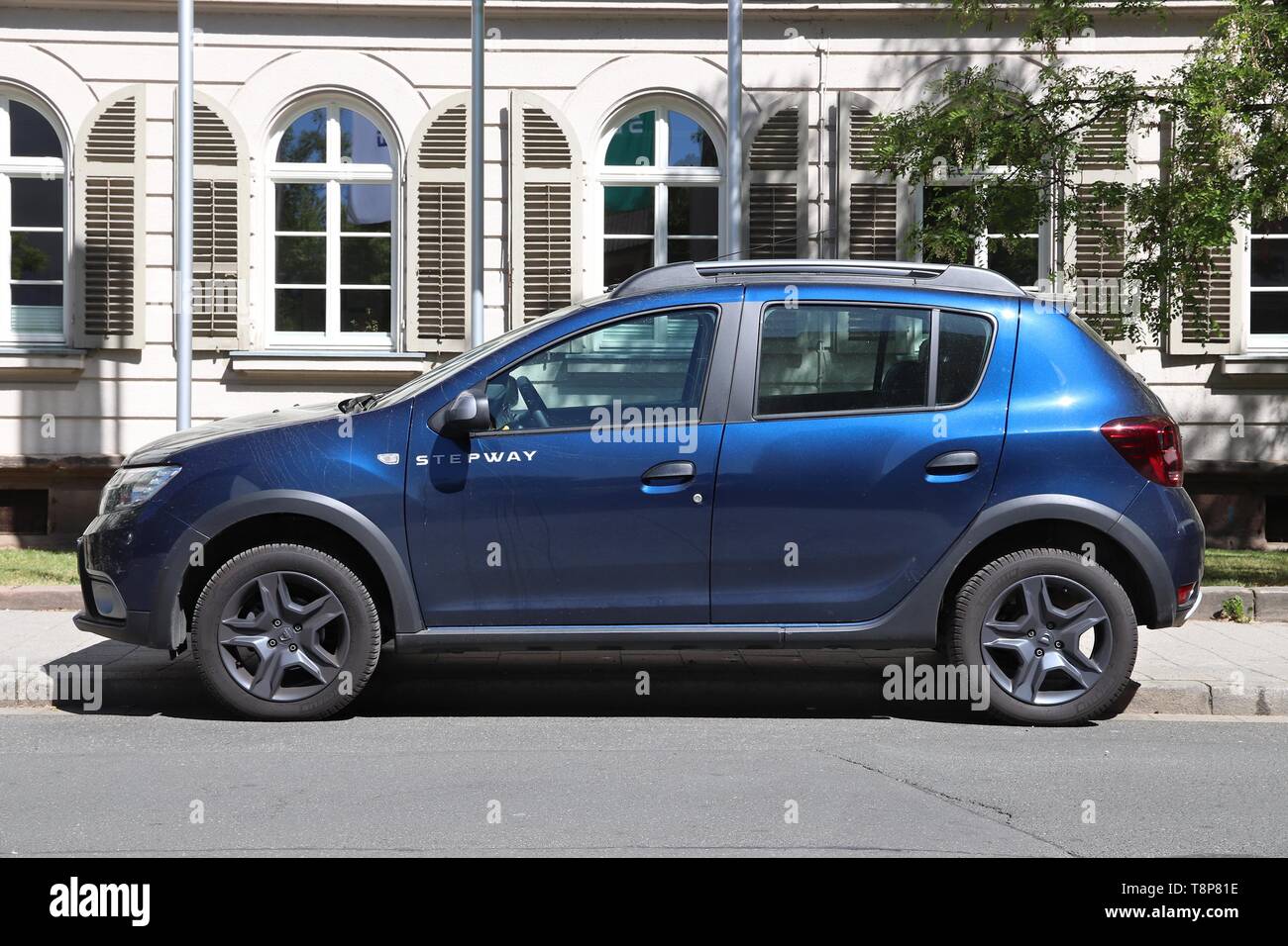 ERLANGEN, GERMANY - MAY 6, 2018: Dacia Sandero Stepway blue compact crossover car parked in Germany. There were 45.8 million cars registered in German Stock Photo