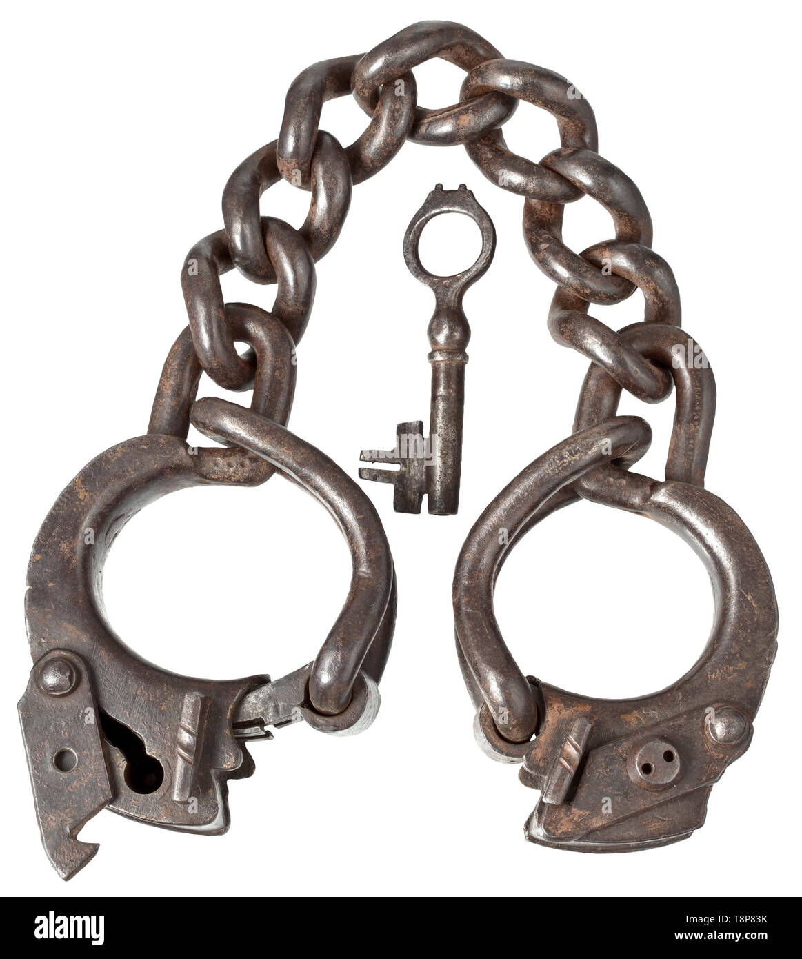 Heavy fetters, 17th/18th century Made of wrought iron. Heavy leg irons connected with a robust chain of seven twisted links. Both shackles with lock clamps and covered and screwable key holes. One of the locks with associated key. Length 62 cm. historic, historical, instrument of torture, torture device, instruments of torture, torture devices, object, objects, stills, clipping, clippings, cut out, cut-out, cut-outs, 18th century, 17th century, Additional-Rights-Clearance-Info-Not-Available Stock Photo