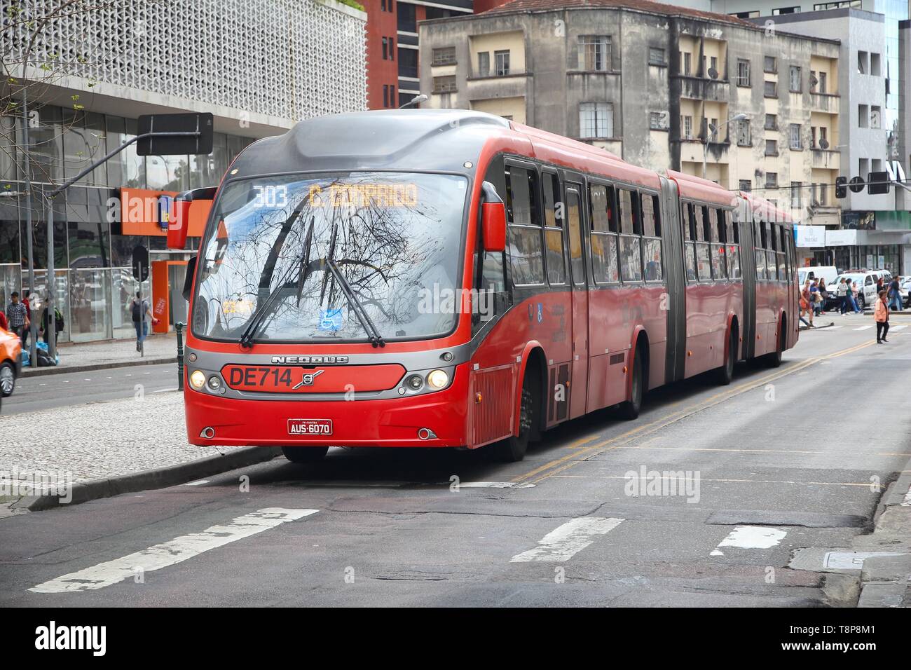 CURITIBA, BRAZIL - OCTOBER 7, 2014: People ride city bus in Curitiba, Brazil. Curitiba's bus system is world famous for its efficiency. Founded in 197 Stock Photo