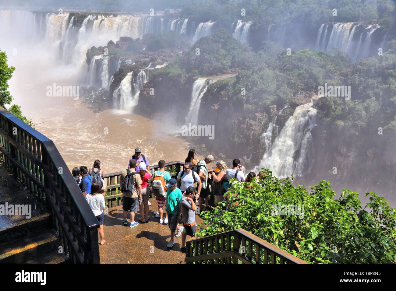 IGUACU NATIONAL PARK, BRAZIL - OCTOBER 9, 2014: People visit Iguacu National Park in Brazil. The park was established in 1939 and is a UNESCO World He Stock Photo