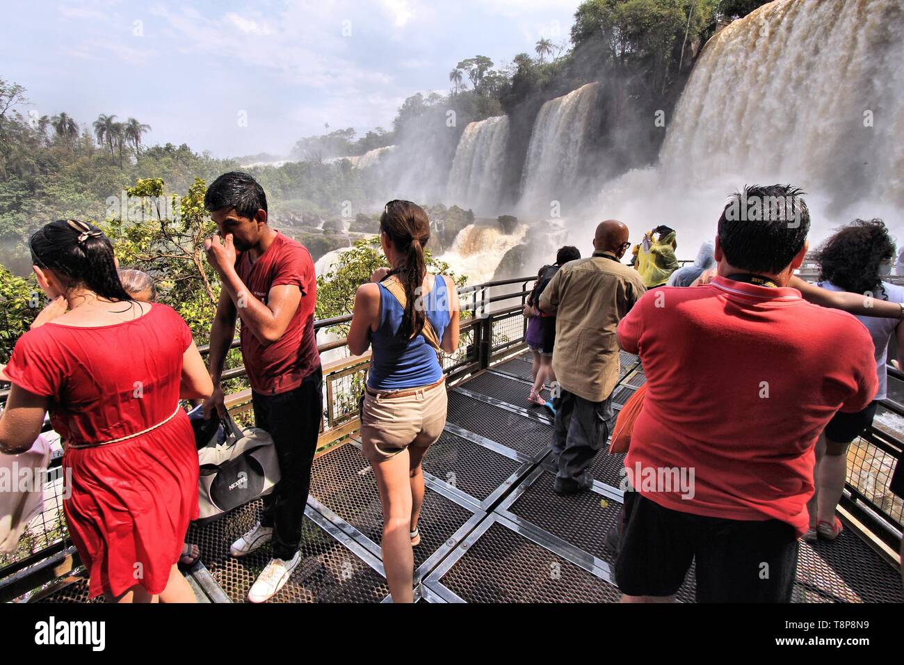 IGUAZU NATIONAL PARK, ARGENTINA - OCTOBER 10, 2014: People visit Iguazu National Park in Argentina. The park was established in 1934 and is a UNESCO W Stock Photo